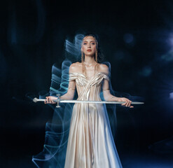 real person sexy face fantasy woman queen holding magic glowing sword in hands. Black dark night room blue moon light fog. Gothic girl warrior with sharp blade shiny dress mixed light art photography