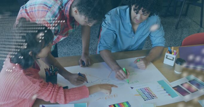 When map overlay pulsing, design team drawing arrows and pointing swatches, refining data mind-map