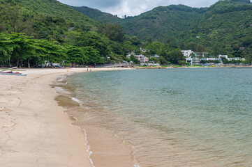 Silvermine Bay Beach located on Tung Wan Tau Road in Mui Wo, Lantau Island, Hong Kong. Seascape and nature, sunny day