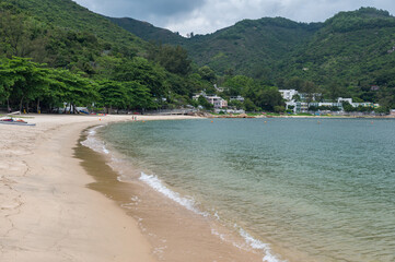 Silvermine Bay Beach located on Tung Wan Tau Road in Mui Wo, Lantau Island, Hong Kong. Seascape and nature, sunny day