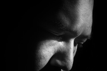 Close Up Male Face in Black and White Shadow