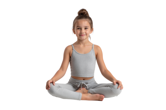 Smiling girl in a yoga pose, looking at the camera, promoting relaxation and healthy lifestyle