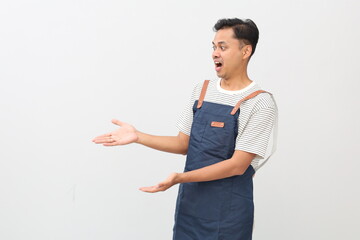 Chef cook holding an empty plate. Portrait of asian chef cook showing plate. Restaurant chef is...