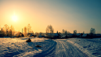 Sunny winter morning in a Russian village. © sergofan2015