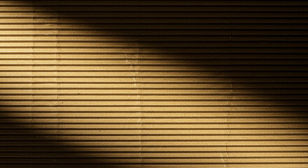 Obraz premium Warm textured corrugated cardboard background with dramatic light and shadow play