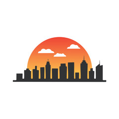 Fototapeta premium Cityscape silhouette at sunset with clouds orange