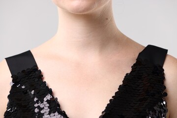 Closeup view of woman on light grey background