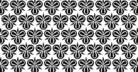 Seamless floral-inspired pattern in black and white with repetitive petal shapes.
