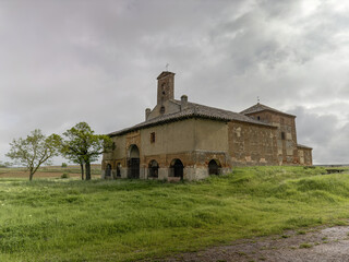 Hermitage of Virgen del Rio near Villada, Palencia, surrounded by green fields