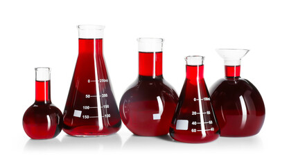 Laboratory glassware with red liquid isolated on white