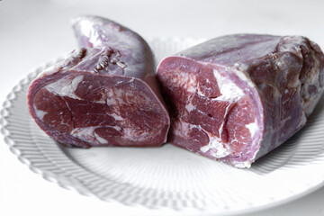 Tender boiled beef tongue served on plate