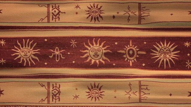 Intricate Woven Textile with Stylized Sun Symbols and Ancient-Inspired Patterns in Warm Tones