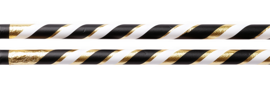 Two striped paper drinking straws with black, white, and gold glitter patterns isolated on transparent background