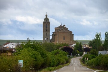 Santa Maria Church in Frechilla, Palencia seen from the road with bell tower and dome