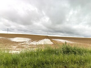 Plowed agricultural field with puddles near Palencia in Castilla y Leon