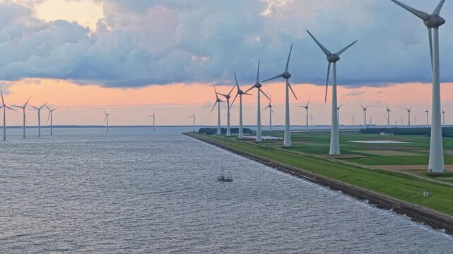 Aerial IJsselmeer wind turbines, electricity over open water, Netherlands