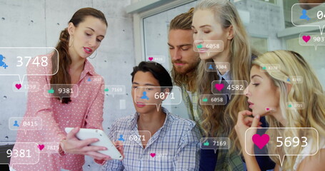 Group of six colleagues reviewing metrics on white tablet in office, with social media overlays