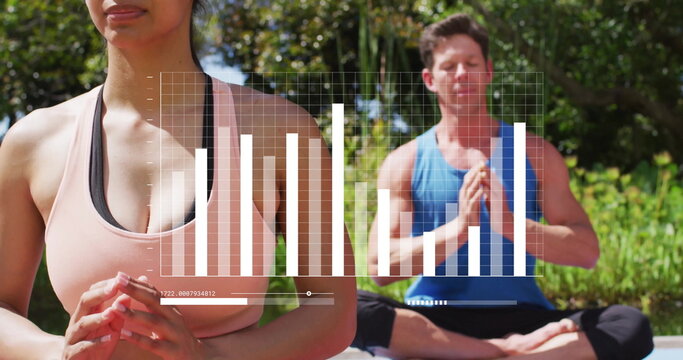 Meditating woman wearing peach sports bra using yoga mat in garden, with data overlay, copy space