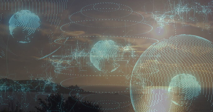 Floating holographic globe drifting above hill and tree line at dusk, with data rings digital lines