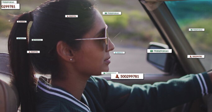 Driving woman with aviator shades steering convertible on paved road, numeric overlays, copy space