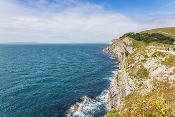 Lulworth Cove limestone cliffs above the English Channel, Dorset Jurassic Coast seascape