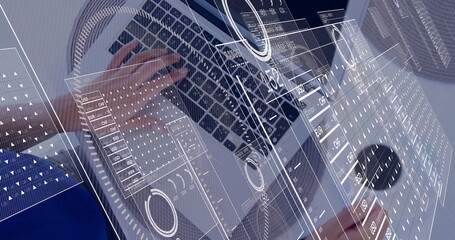 Typing blue-shirted woman viewing currency overlay on laptop at desk with binder, pen holder, mouse