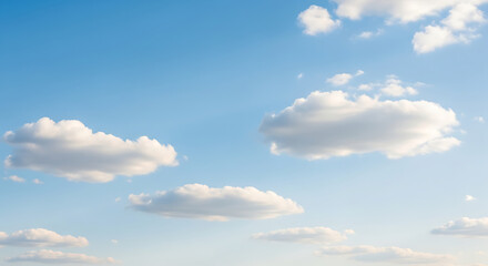 Obraz premium Serene daytime view of a vast blue sky with soft, fluffy white cumulus clouds floating in the bright sunlight, a peaceful atmospheric background