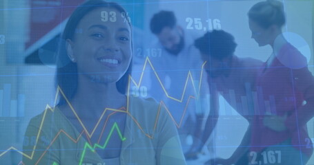 Smiling African American woman in business attire analyzing financial charts in office, with laptop
