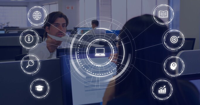 Projecting network interface overlaying workers in business attire at open-plan office, with icons