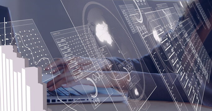 Typing businesswoman analyzing floating data dashboards and charts at office desk, with laptop