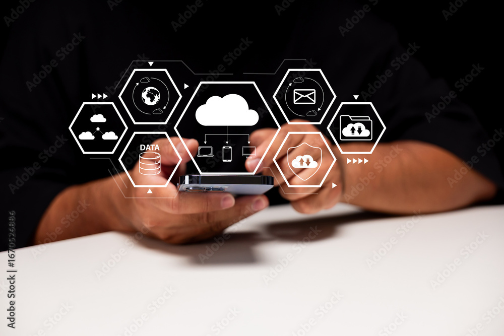 Poster cloud storage and mobile data access. a businessman uses a smartphone in a modern office to connect 