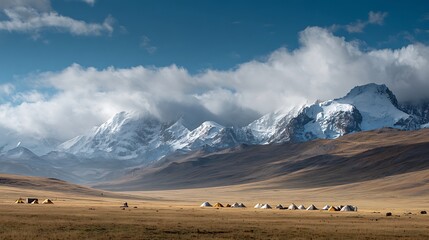 Snowy Mountainscape: A breathtaking panorama of towering mountains, their peaks kissed by pristine snow, dominates the horizon, creating a majestic landscape.