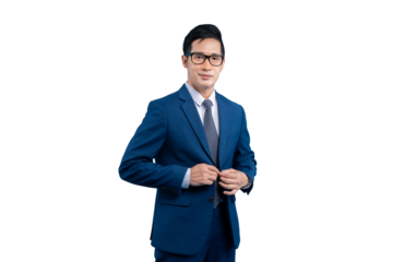 Asian businessman in a blue suit adjusting his jacket on PNG background