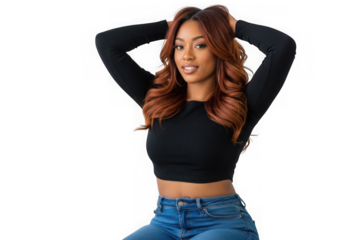 Stylish young woman with auburn hair posing against a black background