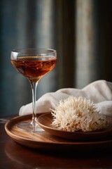 Naklejka premium Elegant cocktail presentation with wooden plate and unique garnish