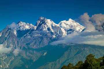 From left - Mount South Kabru (24215 feet), Mount North Kabru and Mount Talung (24200 feet) - beautiful view of Himalayan mountains at Ravangla, Sikkim. Himalaya is the great mountain range in Asia .