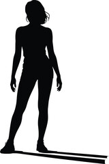 Silhouette of a woman standing with a long shadow