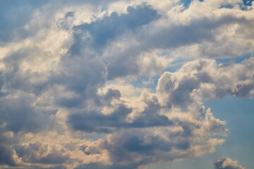 Textured white clouds in close-up create a natural pattern symbolizing cyclicity, Earth's breath,...