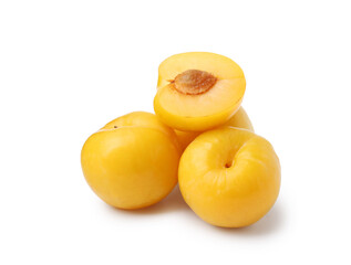 Whole and cut yellow cherry plums isolated on white