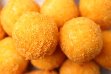 Delicious fried croquette balls as background, top view