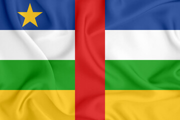 flag of the Central African Republic with stripes and a star on satin fabric with folds and shadows