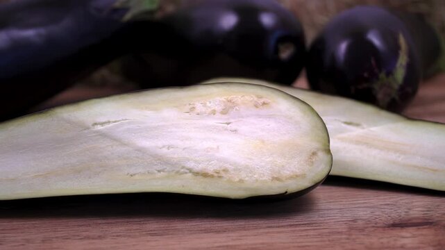 Longitudinal section of Solanum melongena fruit: anatomy of an eggplant.  Close-up of seeds and pulp structure.