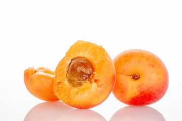 Ripe organic apricots isolated on white background, macro.