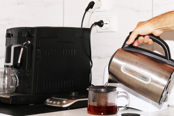 A man prepares breakfast using household appliances.