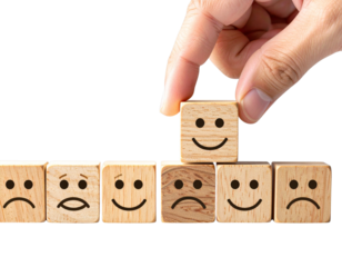 Hand Picking Up Happy Wooden Block from Line of Sad Faces