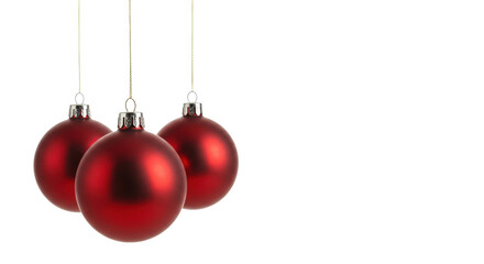 Four matte red spherical glass ornaments with silver caps, red strings, evenly spaced, suspended on a transparent studio background with copy space, concept for elegant festive product marketing