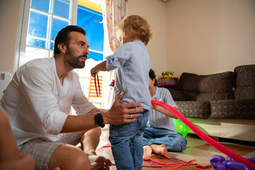 A father cherishes special moments with his child in a cozy home setting, filled with heartfelt...