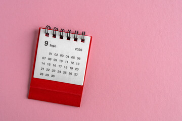 Desktop calendar for September 2025 on a pink background with a dedicated place to copy.