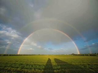 Post-Storm Rainbow Arcing Across Clearing Skies HD HDR Landscape Wallpaper Background
