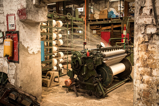 Interior of a historic Colombian textile factory with old industrial machines, traditional architecture and heritage atmosphere of textile production. 28 August 2025 Samac&aacute;, Colombia